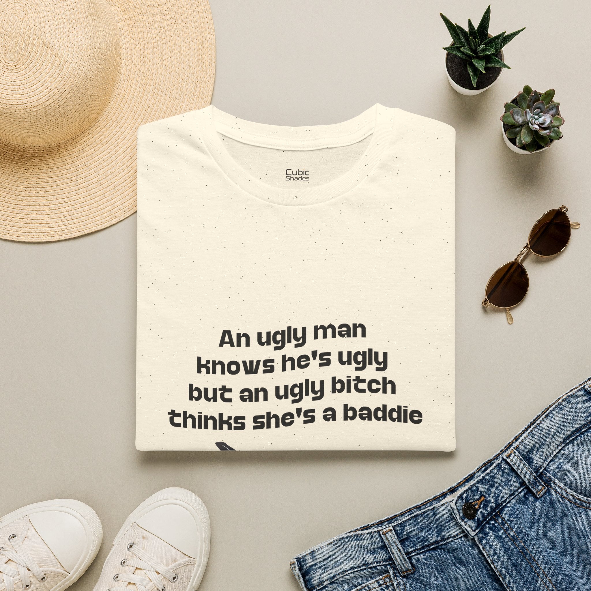 Graphic Tee — "An ugly man knows he's ugly but an ugly bitch thinks she's a baddie"